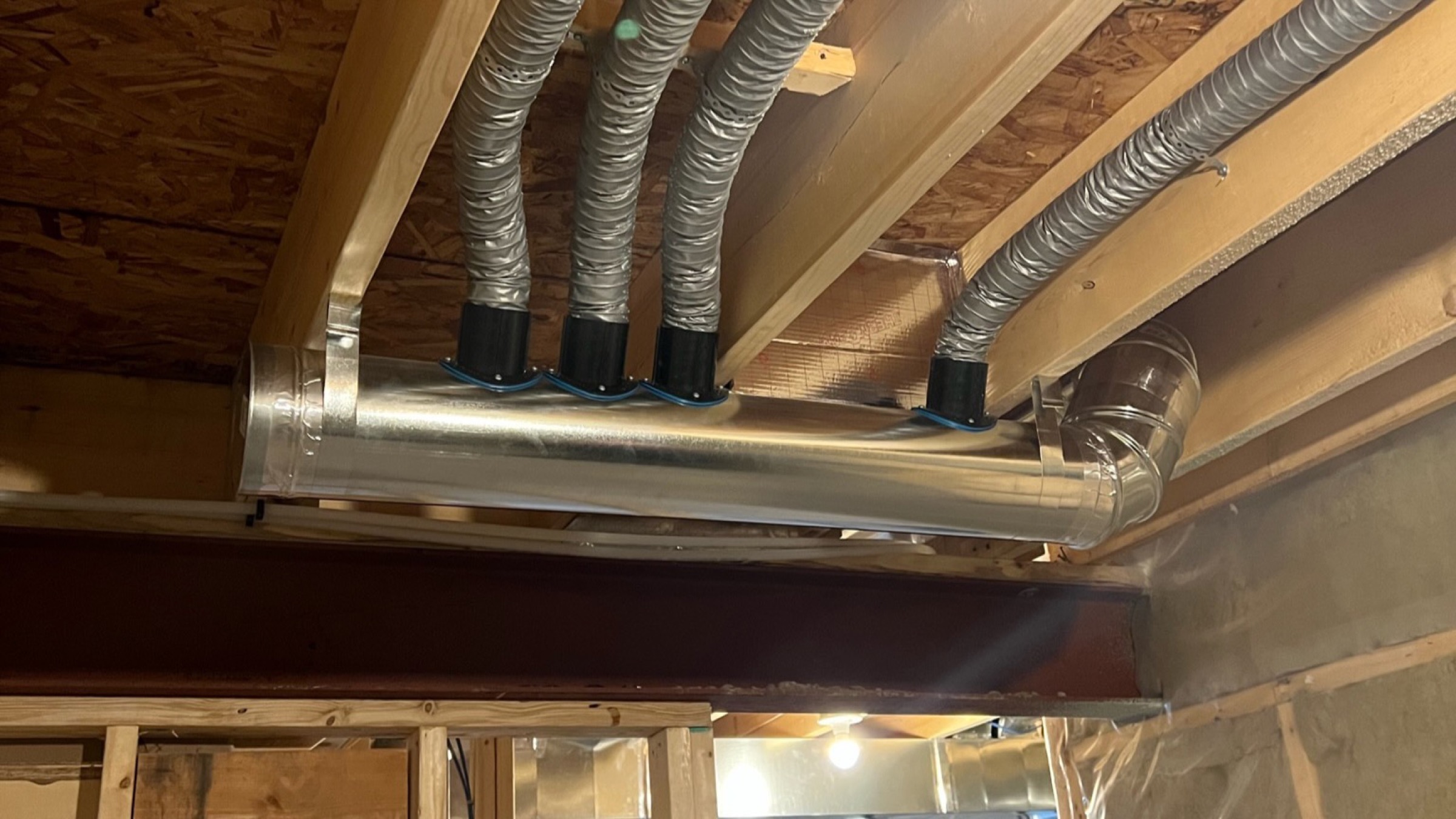 WrightHaven basement HVAC ductwork with engineered supply runs and sealed distribution lines