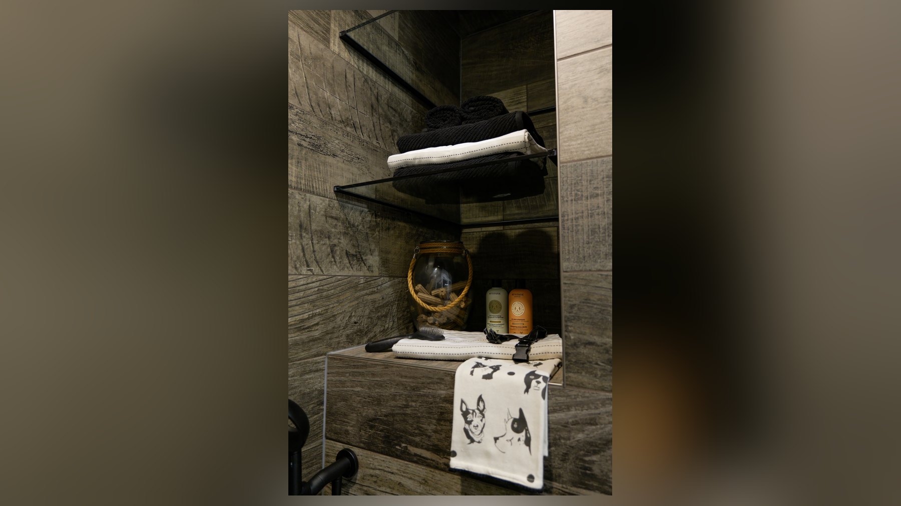 Built-in dog wash with wood tile, treats and open shelving